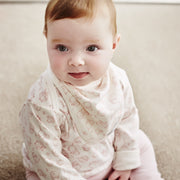 baby girl wearing woodland nursery print London sleeved t-shirt and matching bib by shmuncki