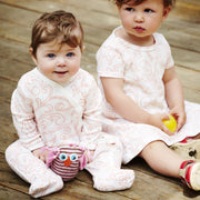 two babies wearing shmuncki baby clothes 0-6 months and 6-12 months