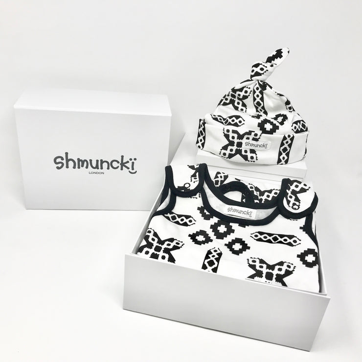 black and white print new baby dungarees and matching hat in a boxed new baby gift set with card and free delivery
